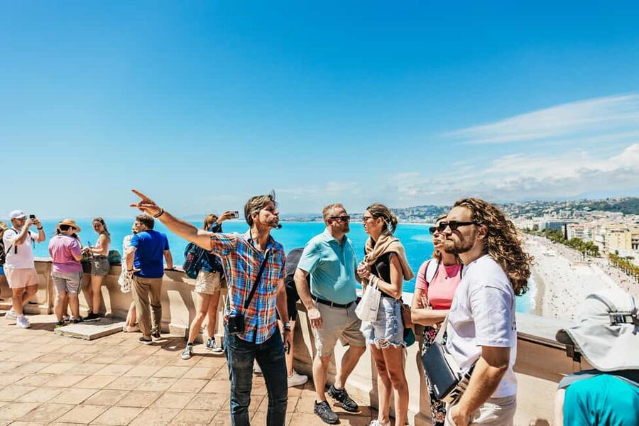 Nice: Old Town & Castle Hill Informative Guided Walking Tour - Place Massena: red facades, Fountain of the Sun, and Piedmontese style